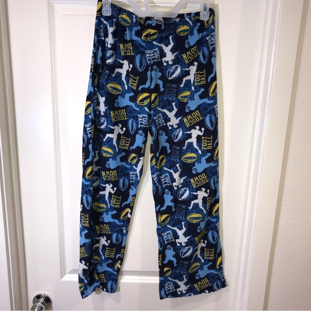 JC Penney’s fuzzy football pajama pants youth size L 14-16 allover print fleece